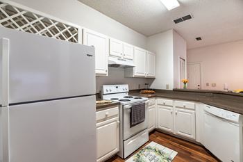 Kitchen with cabinets and appliances